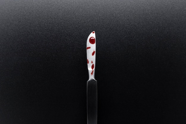 Free photo top view of bloody medical scalpel