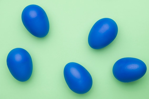 Top view blue colored eggs on table