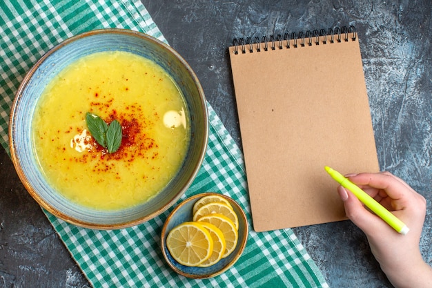 Free Photo top view of a blue pot with tasty soup served with mint