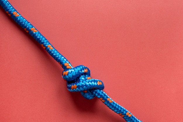 Free photo top view blue rope with knot copy space