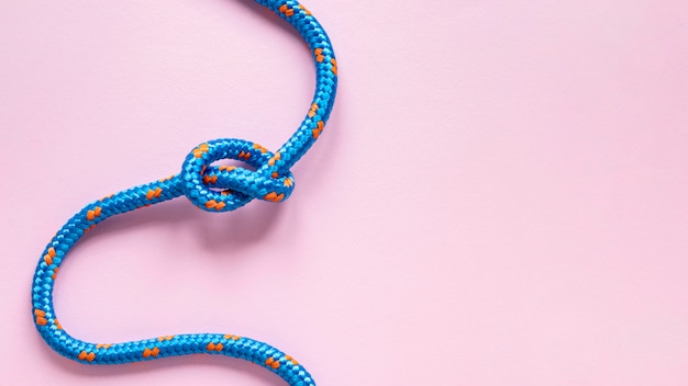 Free photo top view blue rope with knot copy space