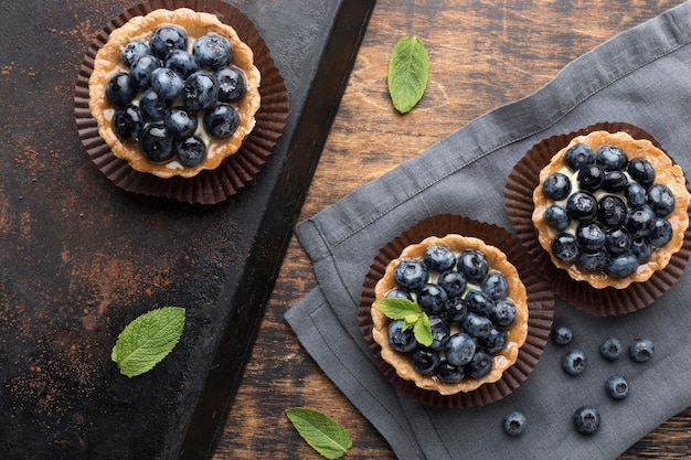 Top view of blueberry desserts with mint