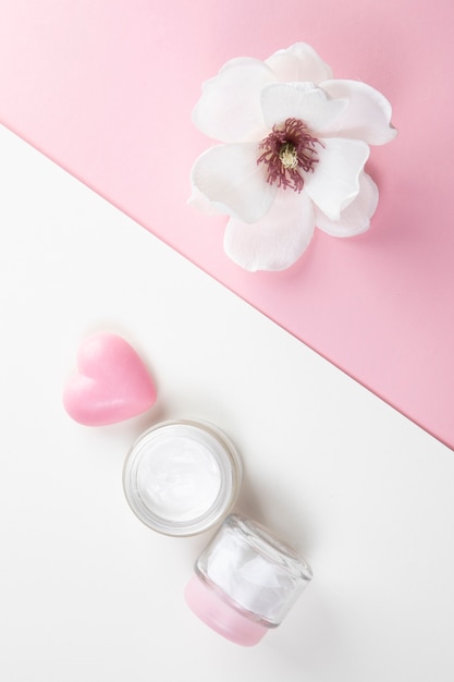 Free photo top view of body butter and hibiscus