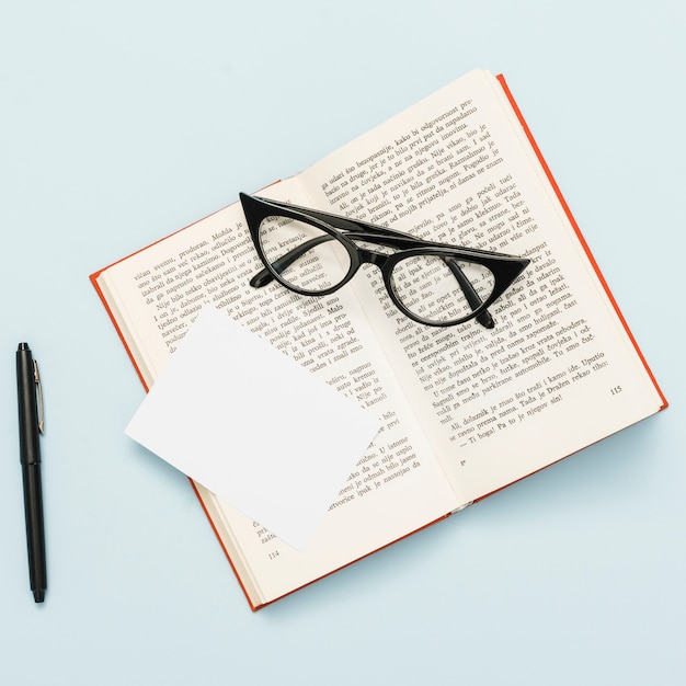 Top view of book and glasses