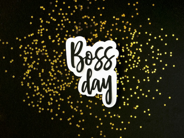 Free photo top view boss day sticker on desk