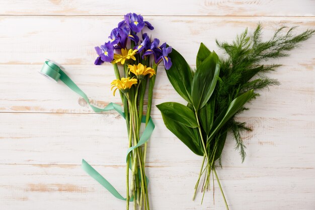 Top view bouquet of flowers on wooden table