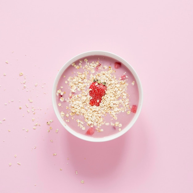 Top view bowl with cereals and fruits