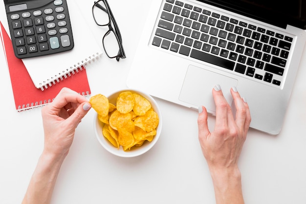 Top view bowl with chips on desk