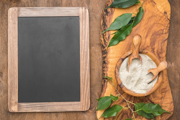 Top view of bowl with powder and chalkboard