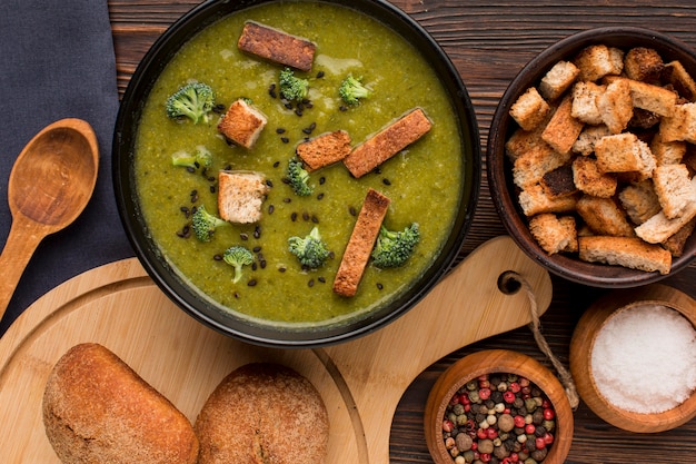 Top view of bowl with winter broccoli soup and croutons