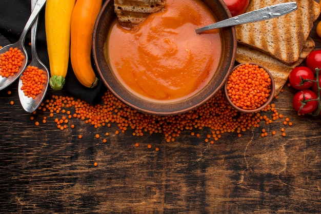 Top view of bowl with winter squash soup and copy space