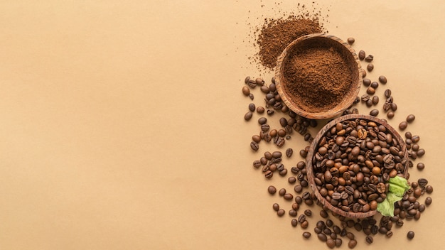 Top view bowls with coffee beans and powder