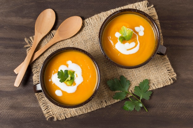 Free Photo top view bowls with cream soup