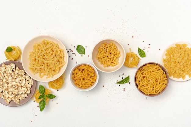 Top view of bowls with different types of pasta