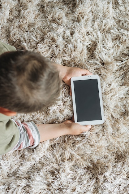 Free photo top view of boy with smartphone template