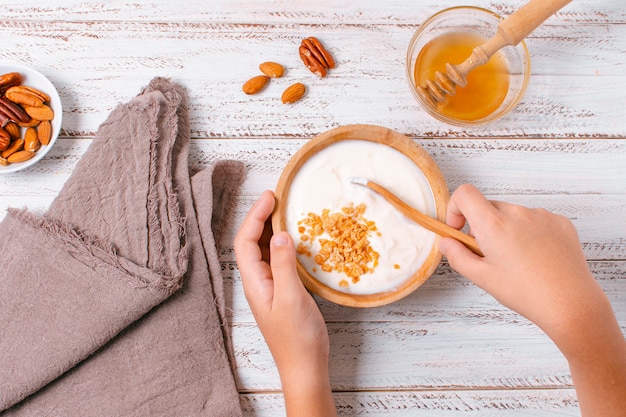 Top view breakfast bowl with yogurt and oats