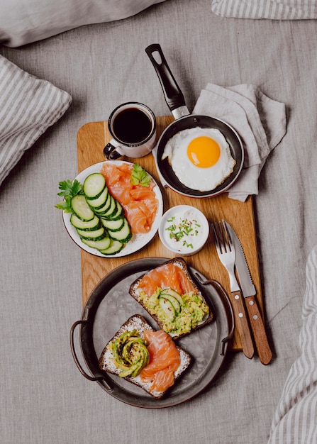 Top view of breakfast sandwiches on bed with fried egg and toast