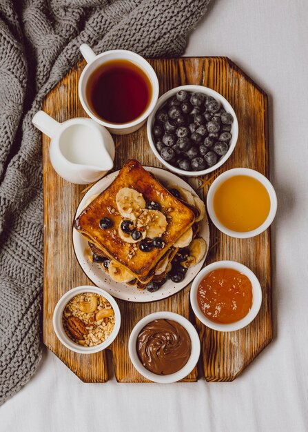 Top view of breakfast toast with blueberries and banana