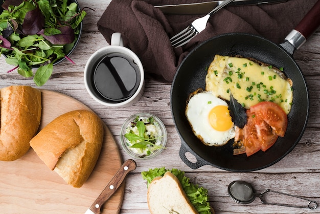 Top view breakfast with eggs and vegetables