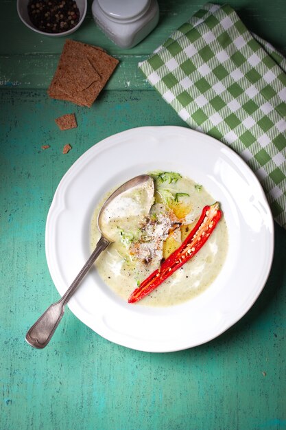 Top view of broccoli soup with chili