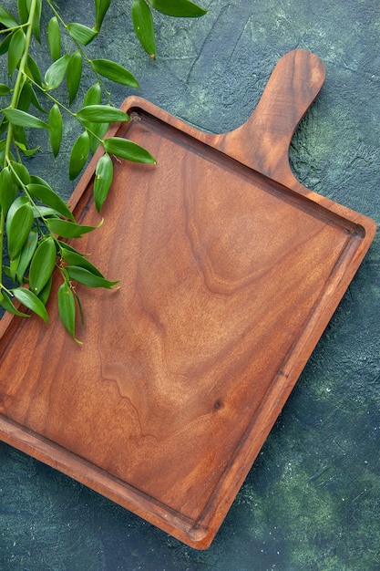 Top view brown wooden desk on a dark blue background food color meat kitchen ancient knife butcher cuisine