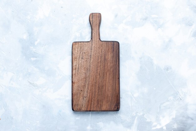 Top view of brown wooden desk, for food made from wood on light, wood wooden