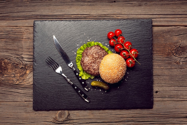 Free photo top view buger on a black board