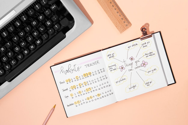 Free photo top view bullet journal and keyboard