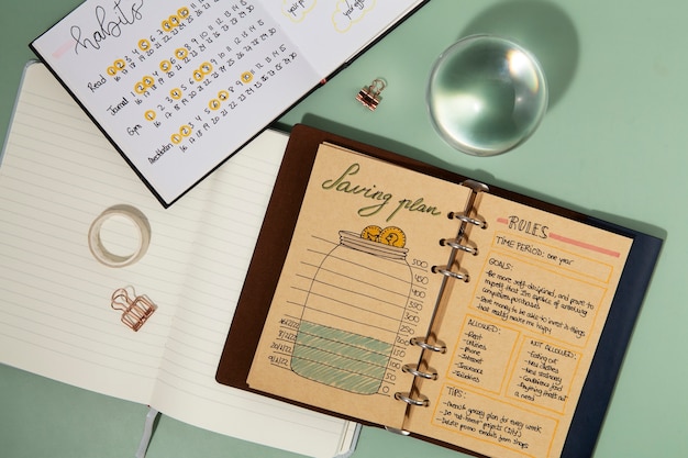 Free photo top view bullet journals and paper clips