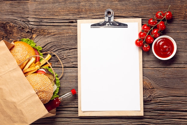 Free Photo top view burger with mock-up clipboard