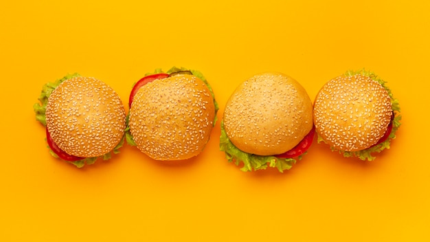 Top view burgers with orange background