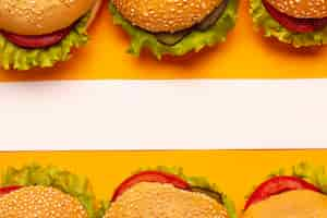 Free photo top view burgers with a white stripe