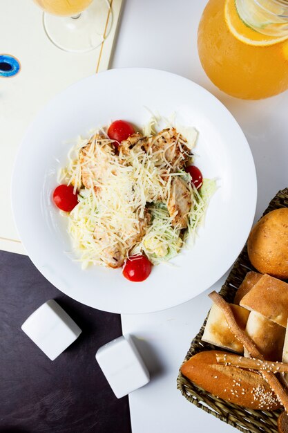 Top view of caesar salad with grilled chicken