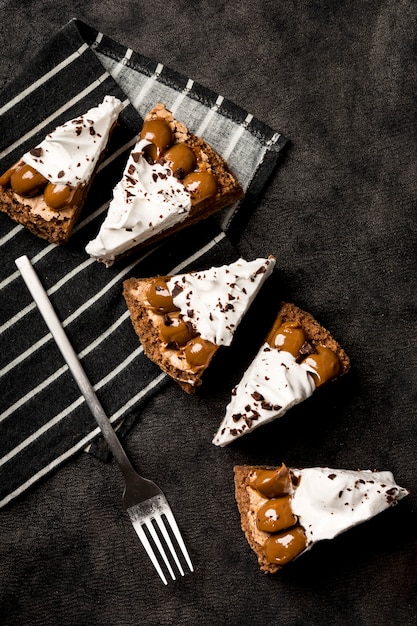 Top view of cake slices on cloth with fork