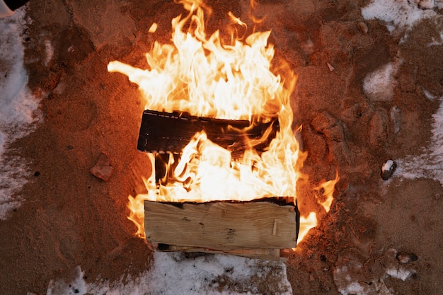 Free photo top view of camp fire burning during winter