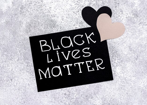 Top view of card with black lives matter and hearts