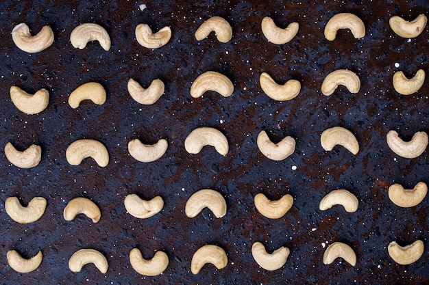 Free Photo top view of cashew nuts isolated on black background