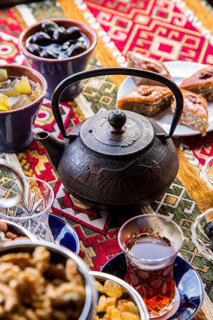 Top view cast iron kettle with baklava