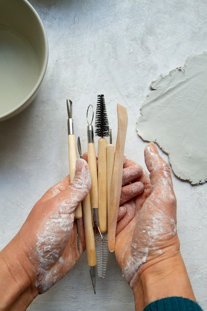 Free photo top view ceramic and pottery tools