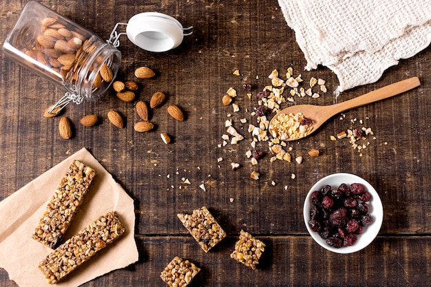 Free photo top view of cereal bars with almonds and cranberries