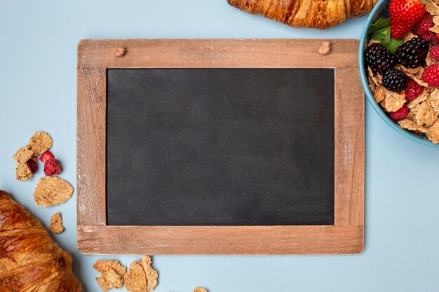 Top view of cereals with fruit and frame