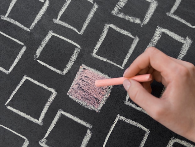 Top view chalk orange square surrounded by white contoured squares