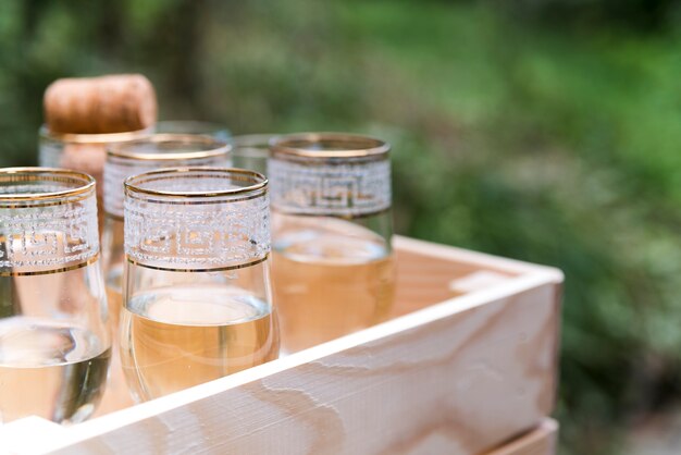 Top view of champagne glasses in wooden crate