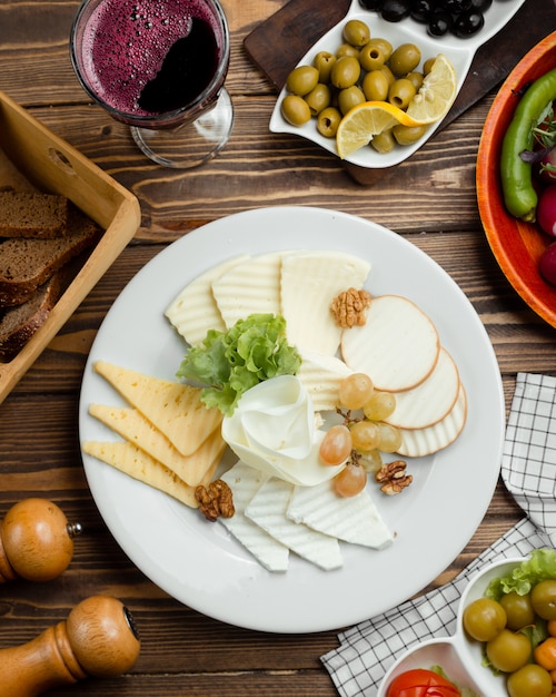 top view of cheese plate with red wine