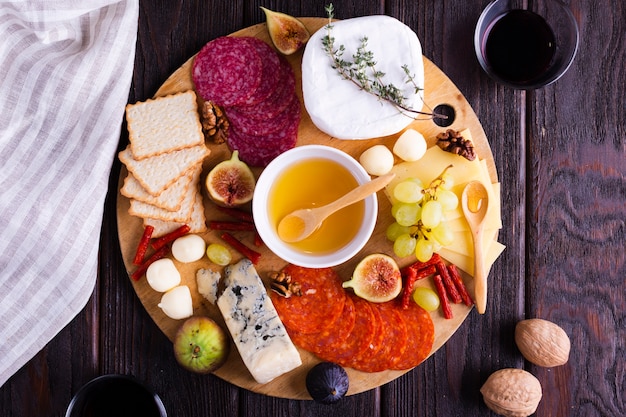 Free Photo top view cheese and snacks on a table