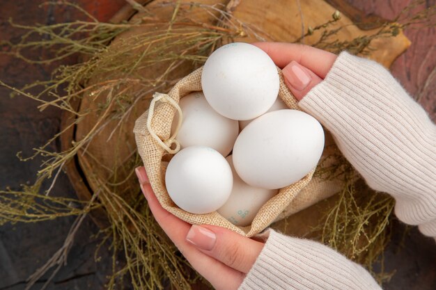 Free photo top view chicken eggs inside little bag