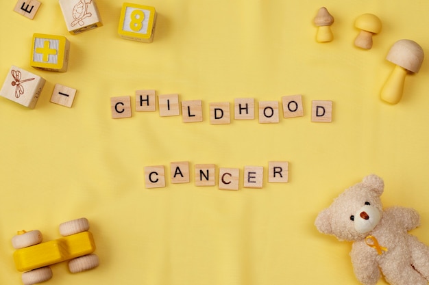 Top view over childhood cancer awareness month background concepttoys,