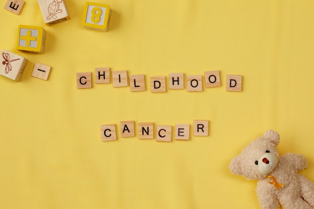 Top view over childhood cancer awareness month background concepttoys,