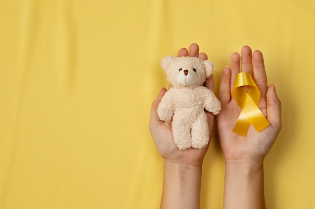 Top view over childhood cancer awareness month background concepttoys,