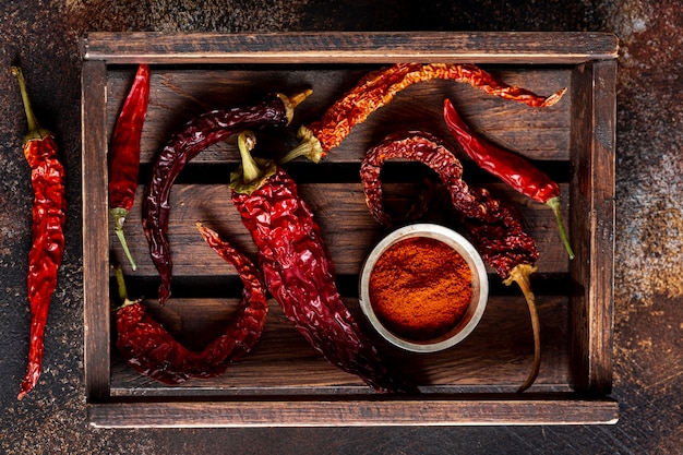 Top view of chili peppers on wooden tray